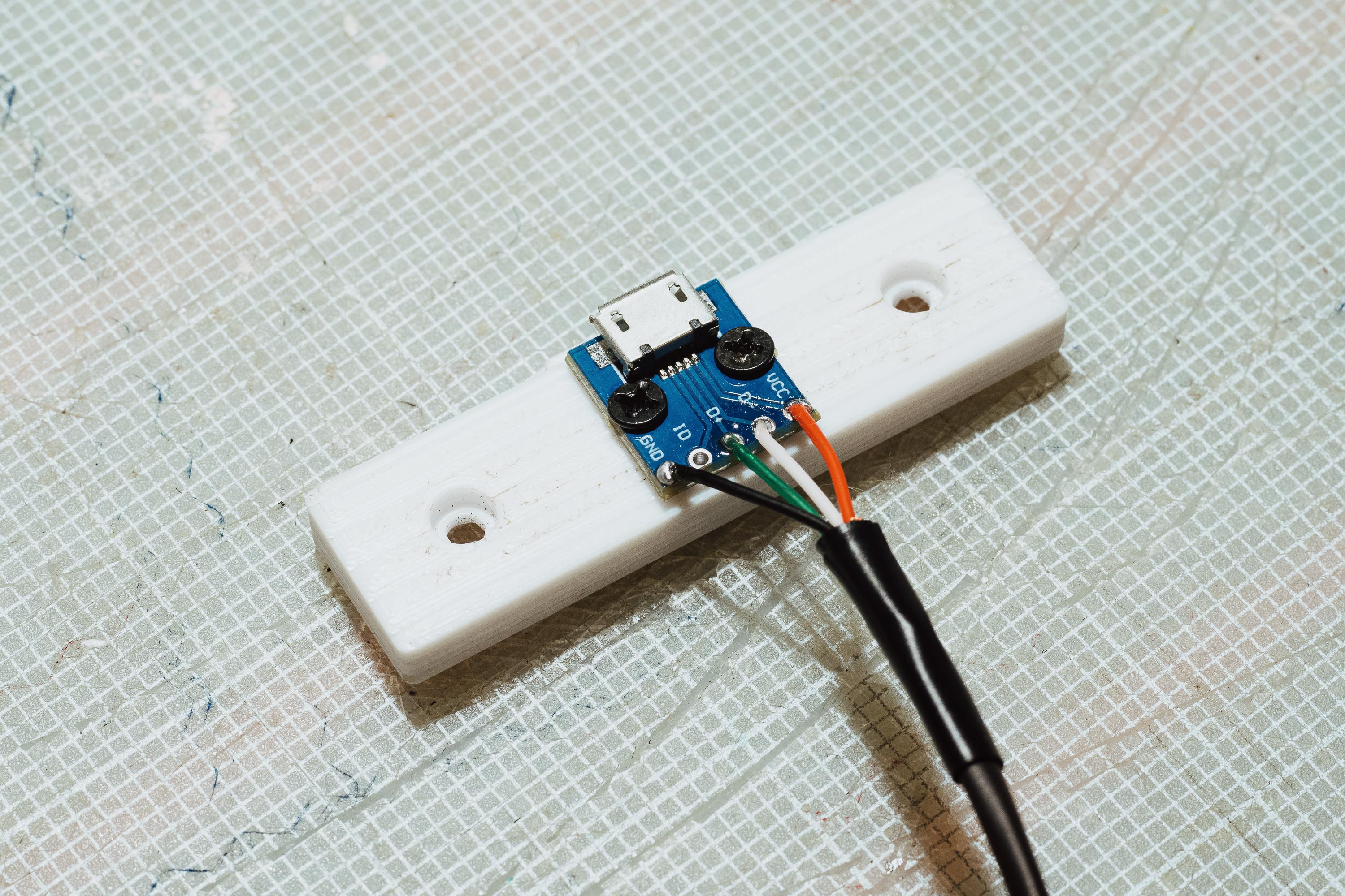 Receptacle mounted to printed part